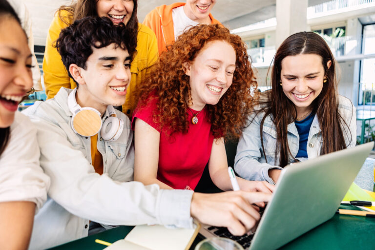 Young group of student people studying together at college campus