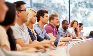 Class Of University Students Using Laptops In Lecture