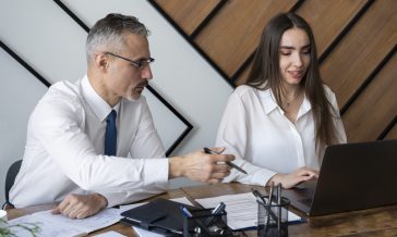 medium-shot-people-sitting-desk